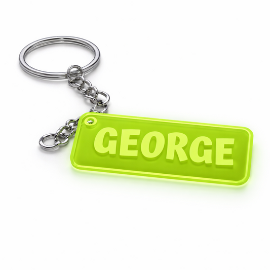 Keychain with a green tag displaying the name 'GEORGE' on a white background